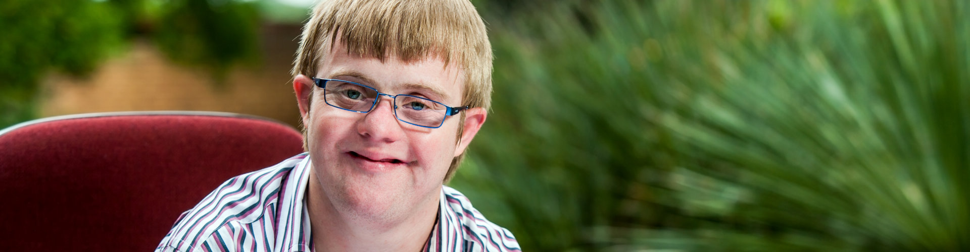 smiling boy with down syndrome